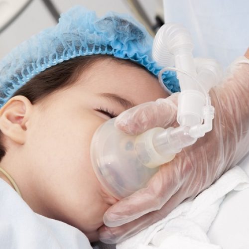 Portrait of child patient receiving artificial ventilation in hospital